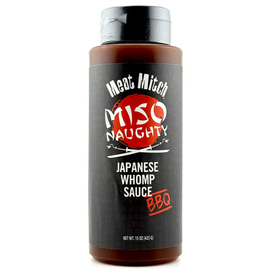 Miso Naughty Whomp Sauce 15oz Tall squeeze bottle with black label with red and white print. Contains dark brown Miso Whomp sauce.